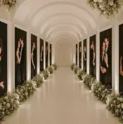 Hallway portrait gallery with greenery